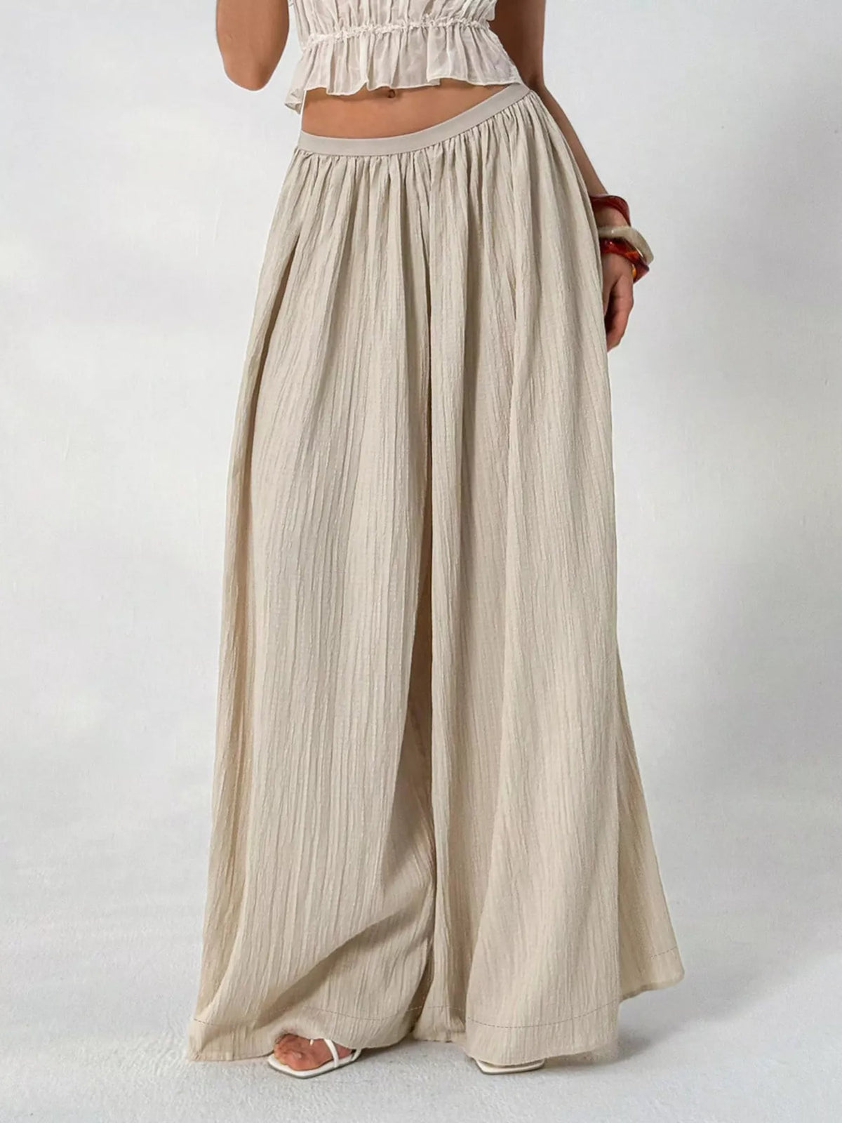 Back view of the textured wide leg pants in khaki