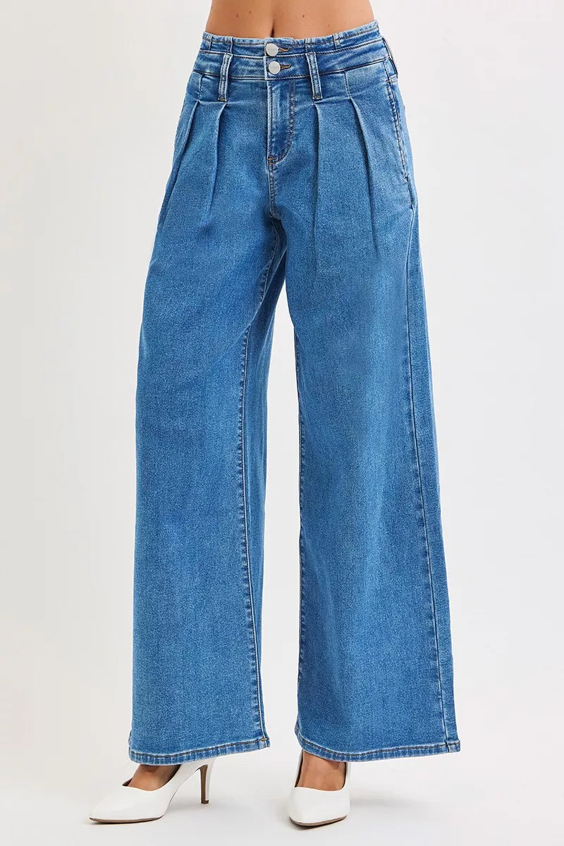 Medium wash pleated wide leg jeans side profile