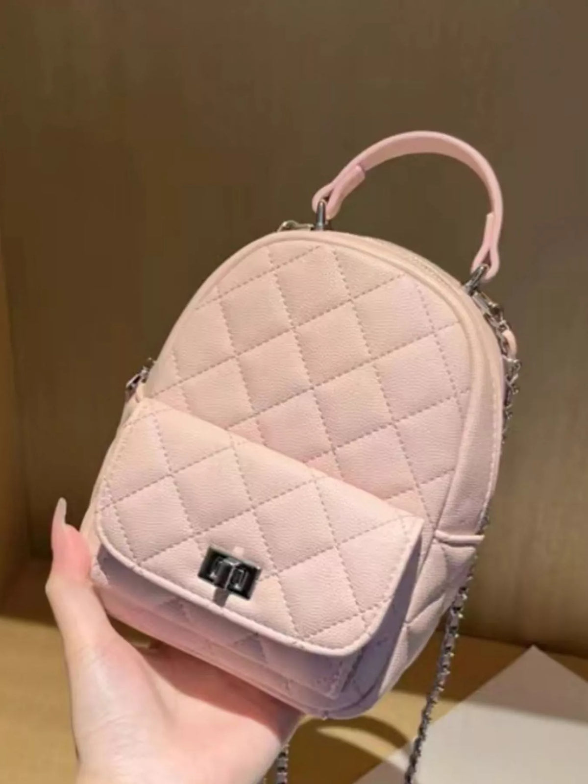 Quilted mini backpack side profile
