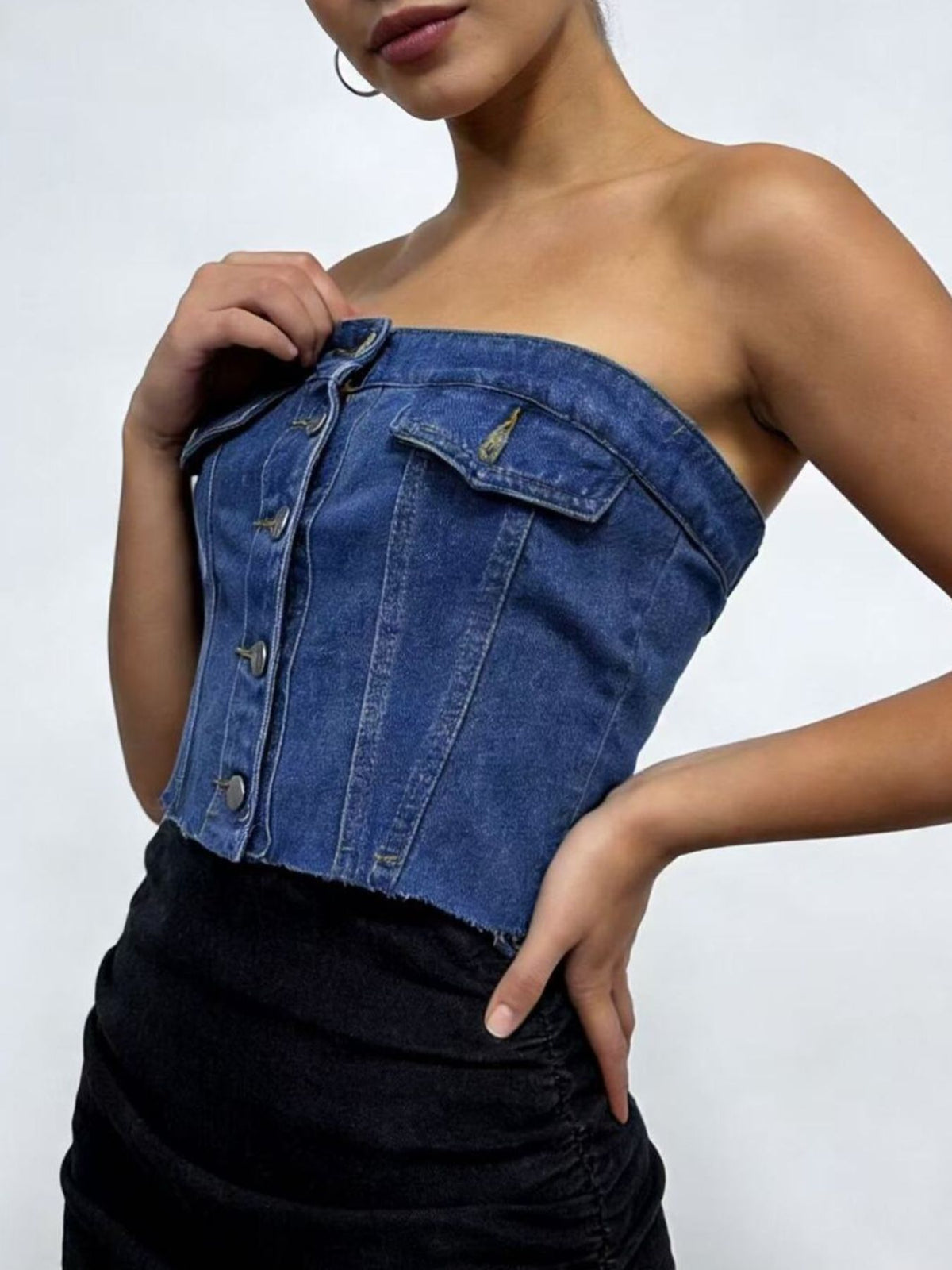 Button front and pocket detail of the denim tube top