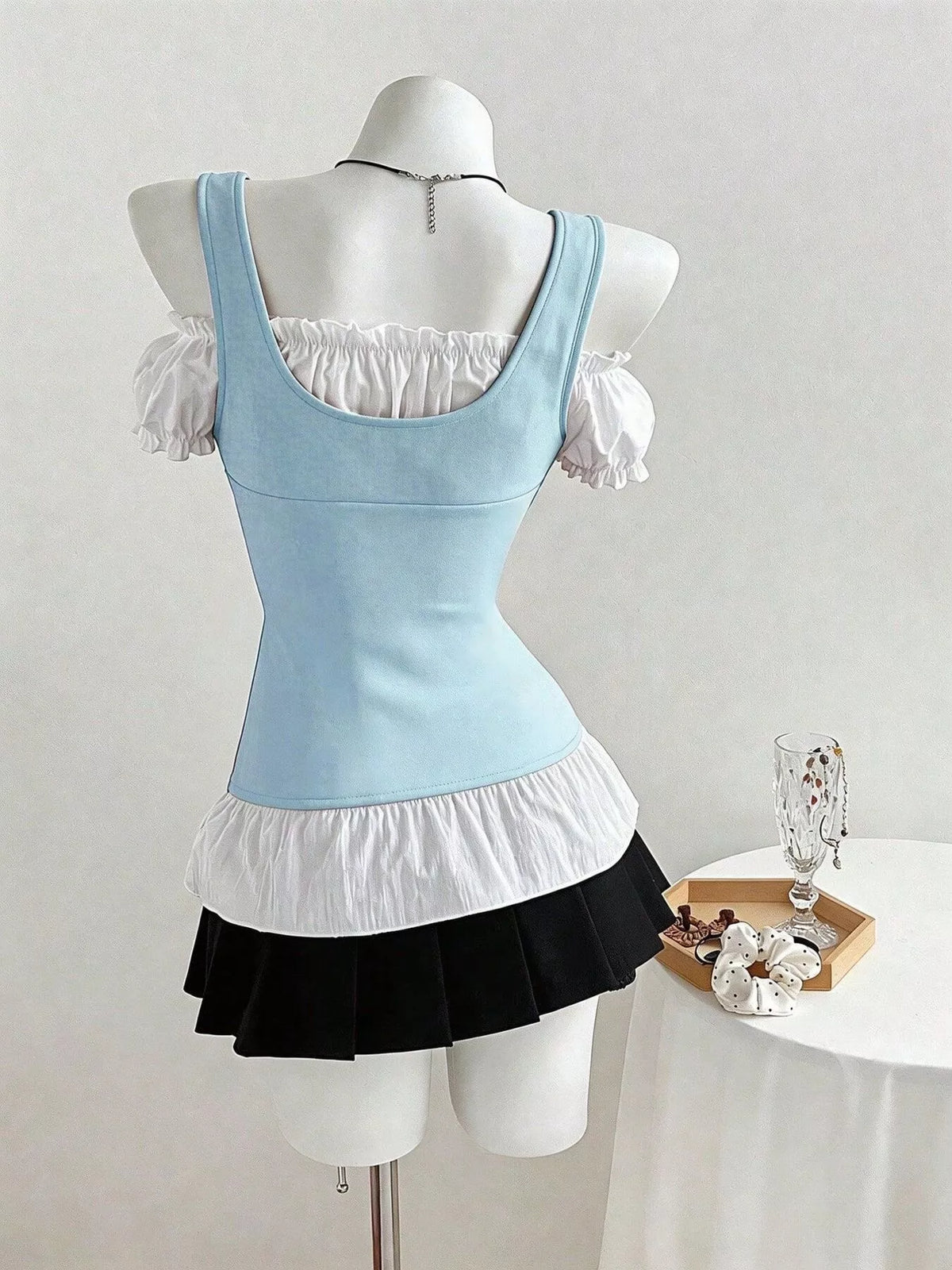 Cold shoulder ruched top flat lay product view