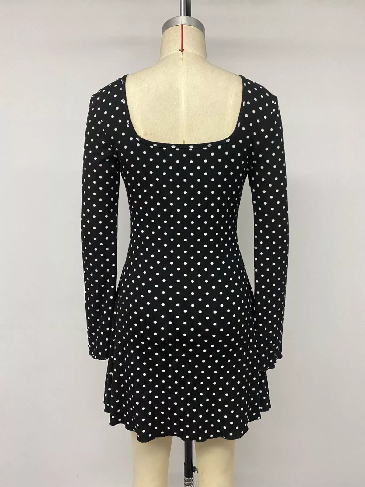 Black lace trim mini dress styled for a night out