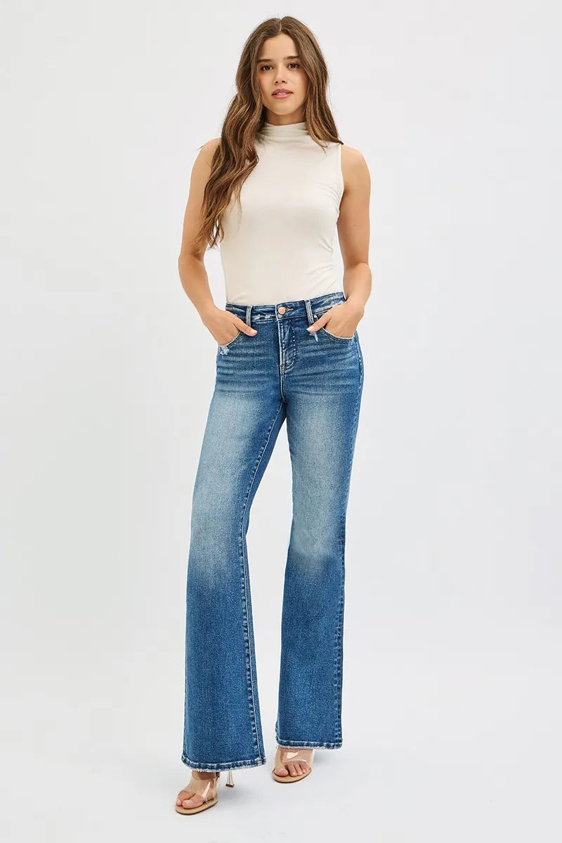 Model wearing RISEN high rise flare jeans elongated look
