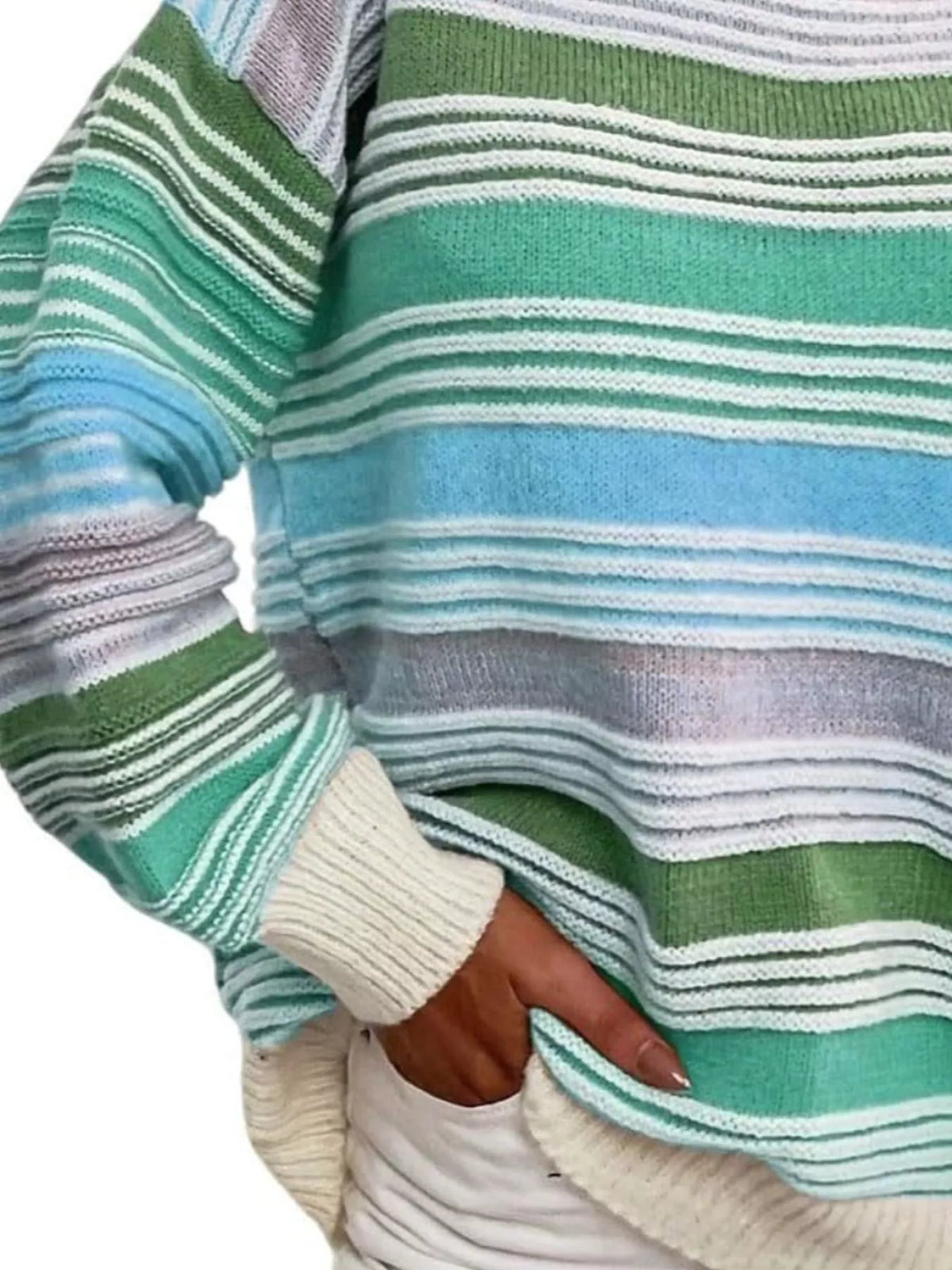 Rainbow striped oversized sweater paired with denim