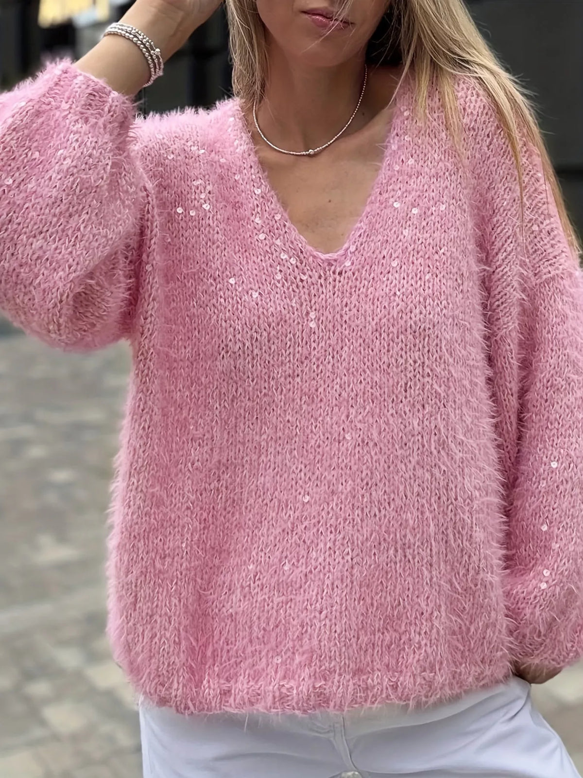Fuzzy pink knit top texture close up