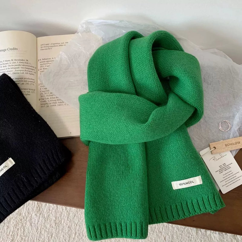Warm knitted wool scarf wrapped around the neck