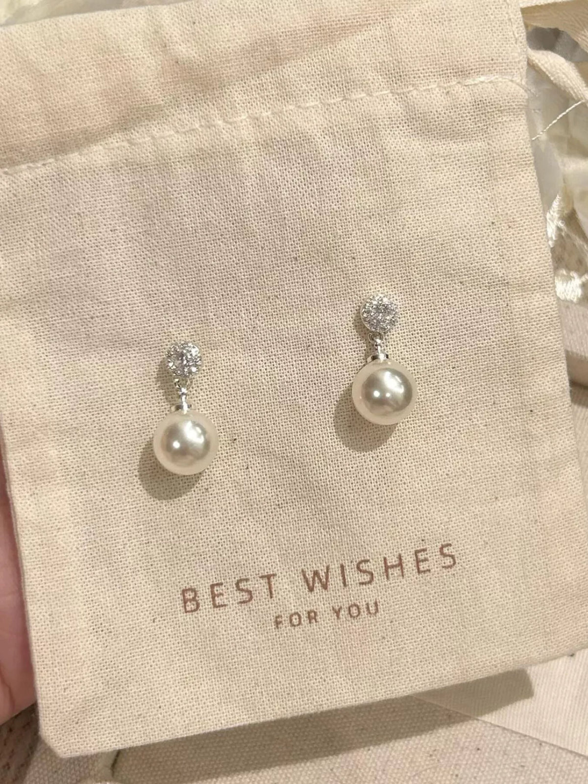 Cream pearl drop earrings pair view