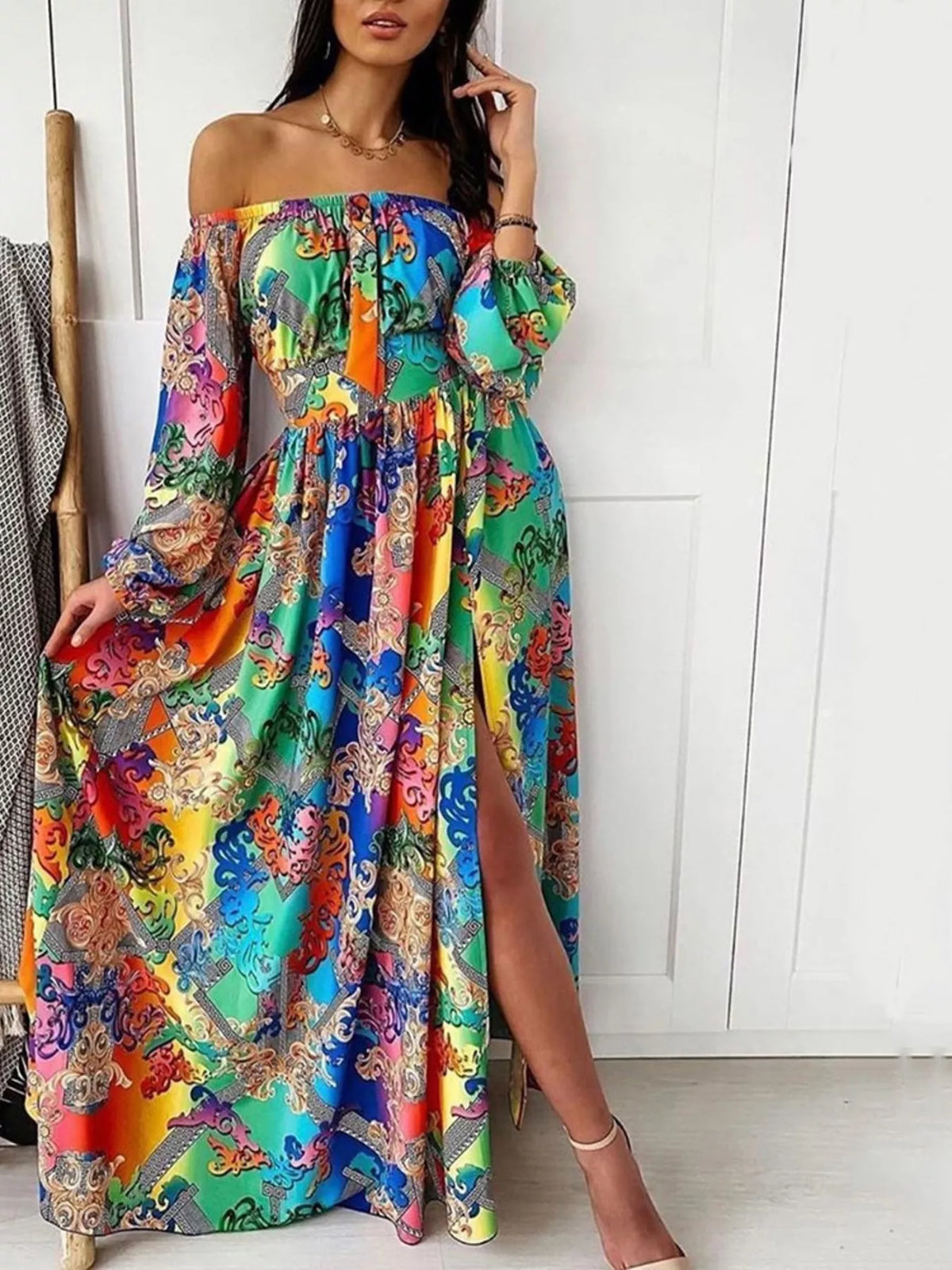 Printed off shoulder maxi dress with a leg slit shown on a model