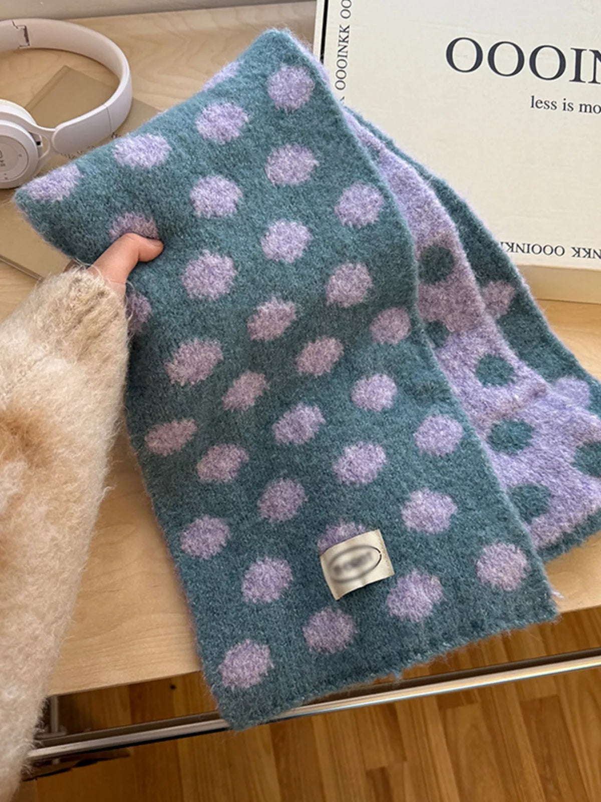 Polka dot scarf shown in a warm brown tone