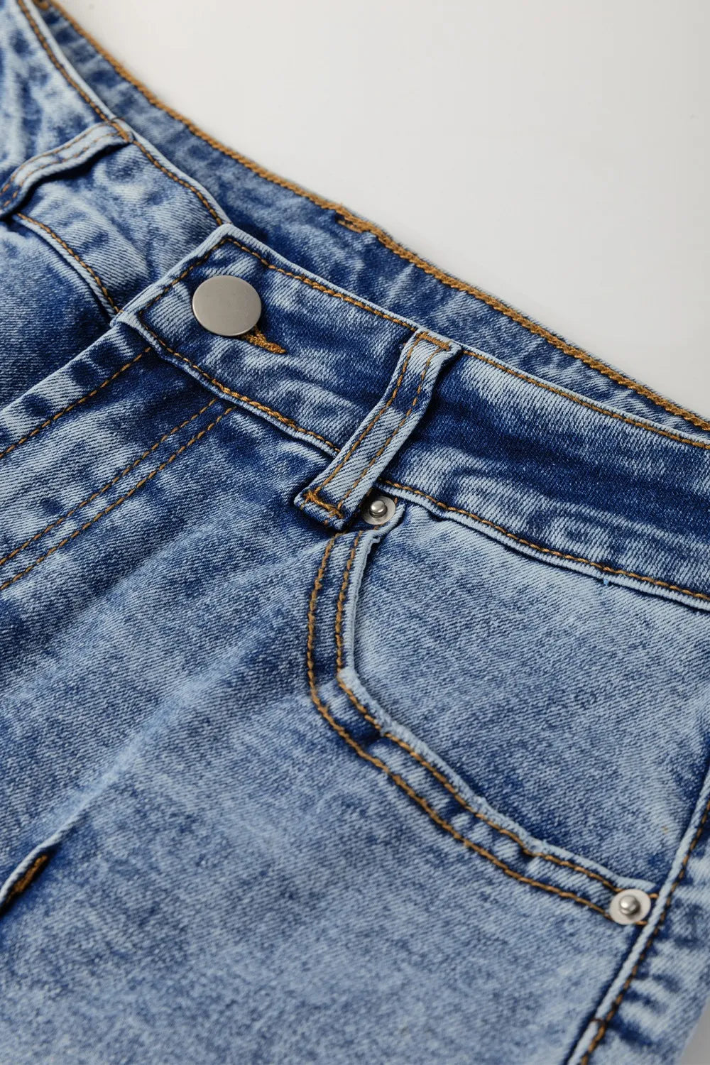 Model wearing cuffed wide leg jeans