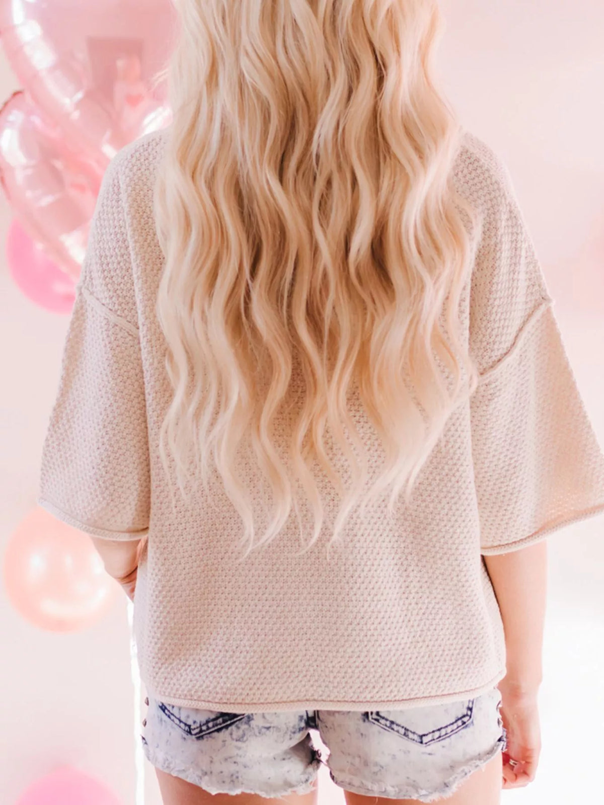 Heart print sweater V-neckline detail