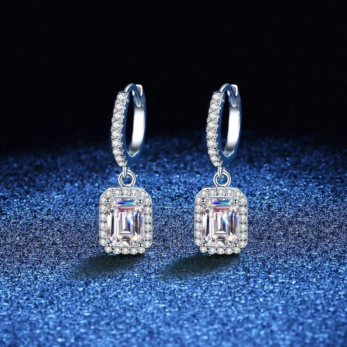 Moissanite drop earrings worn on ear