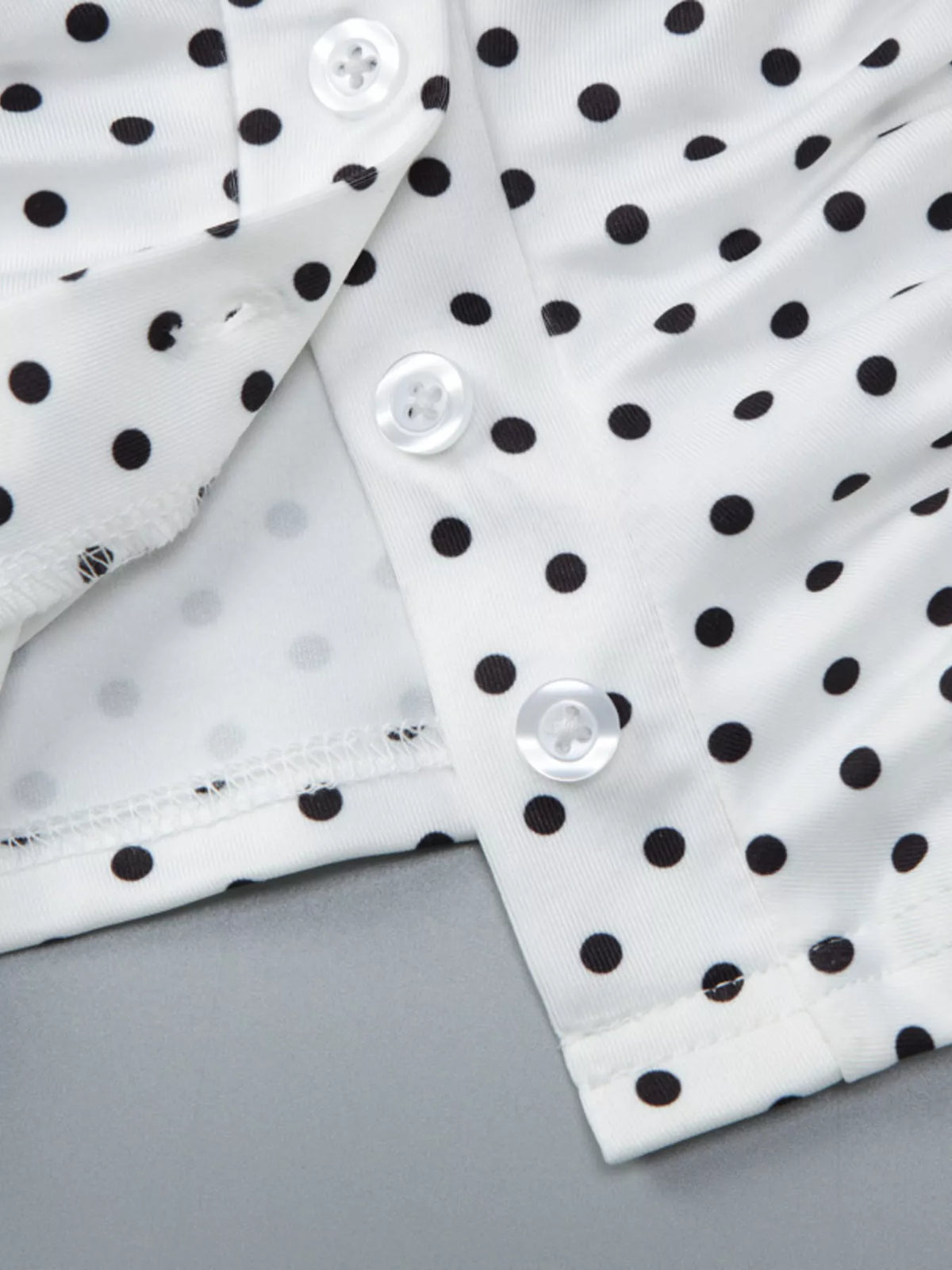 Detail of the stretch fit on the polka dot top