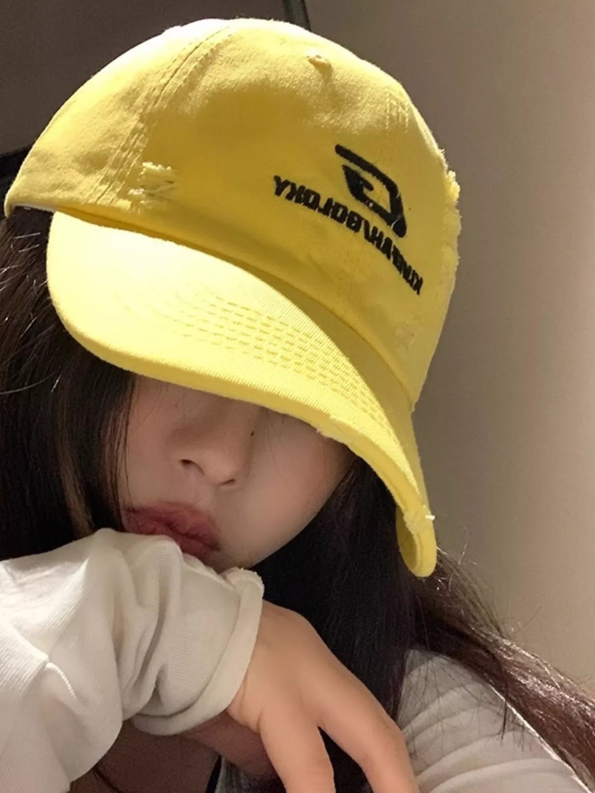 Yellow baseball cap side profile showing crown height
