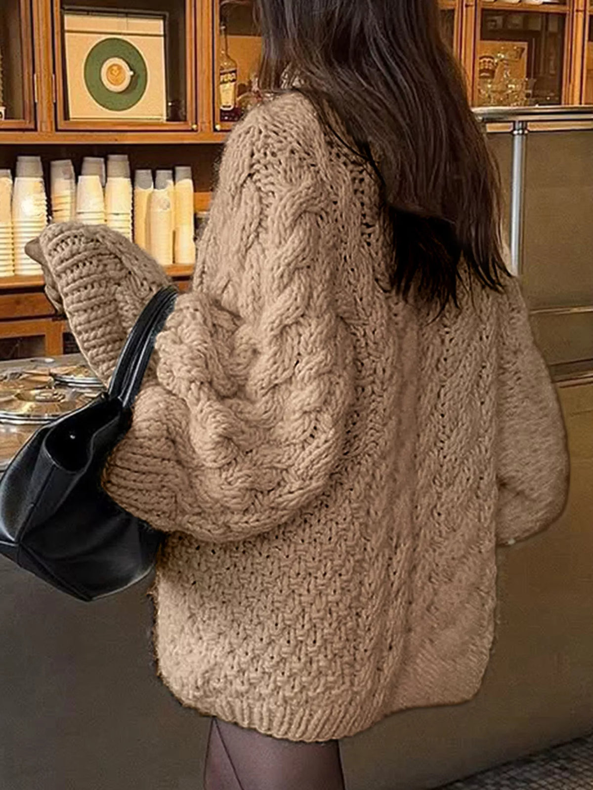 Cable knit round neck sweater, full length view