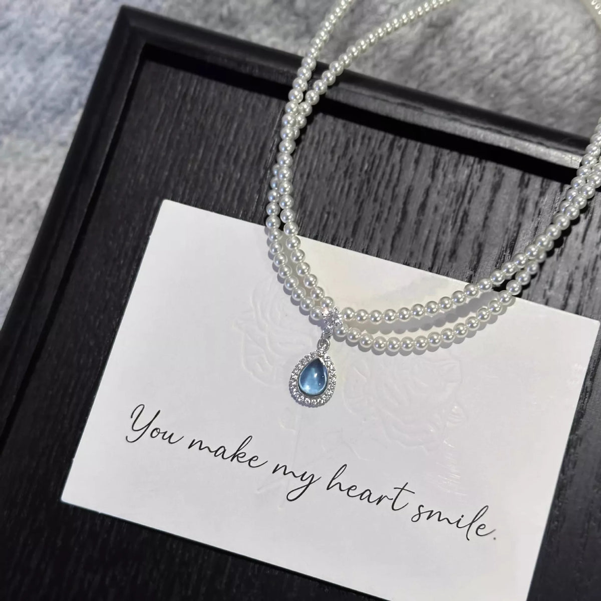 Double layered pearl teardrop pendant necklace full length view