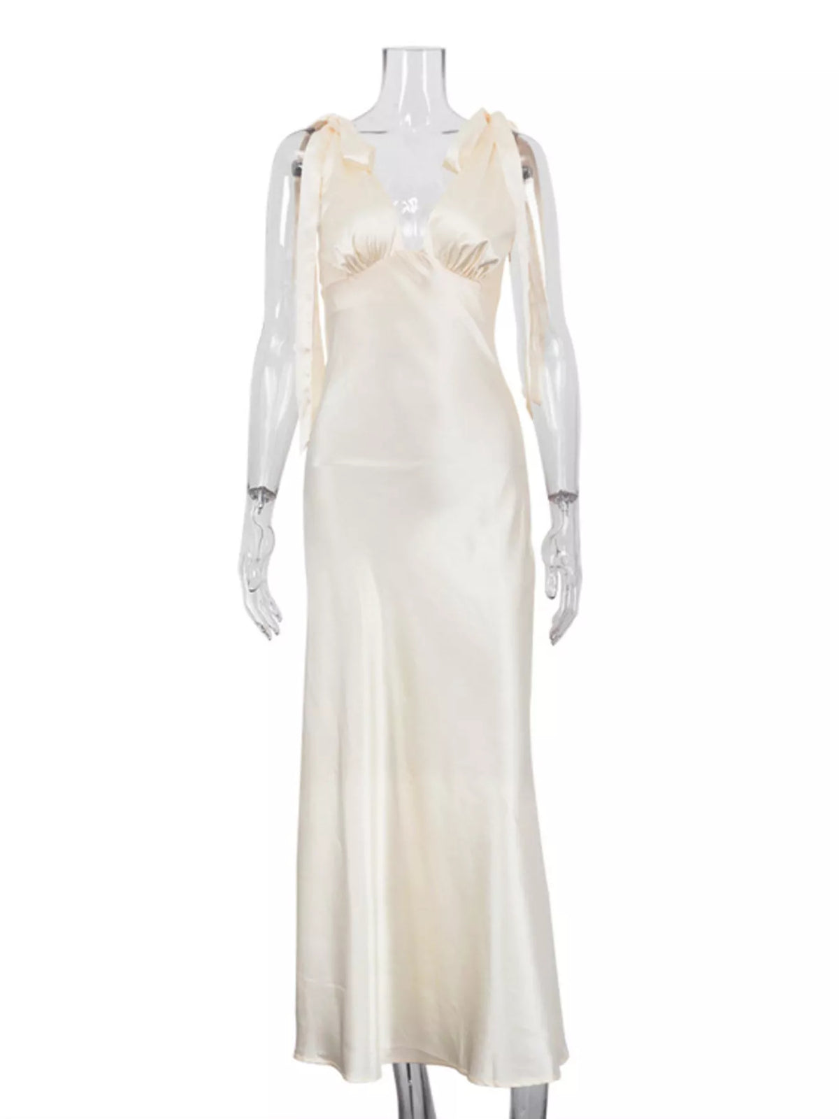Side view showing the satin fall of the long dress