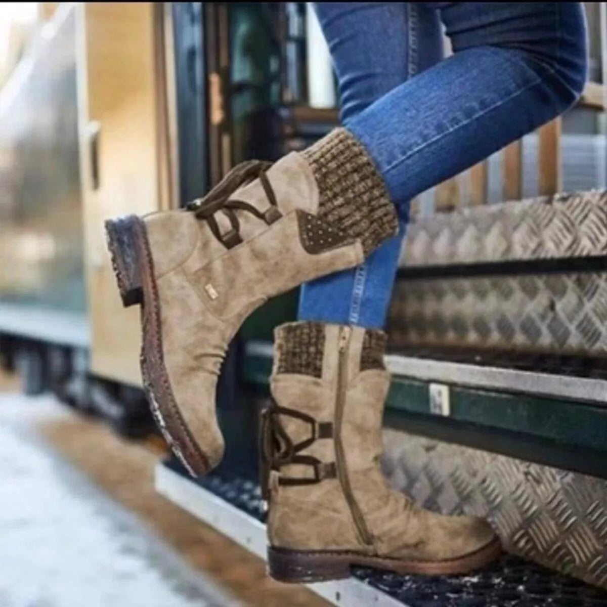 Grey knitted cuff round toe boots pair standing together
