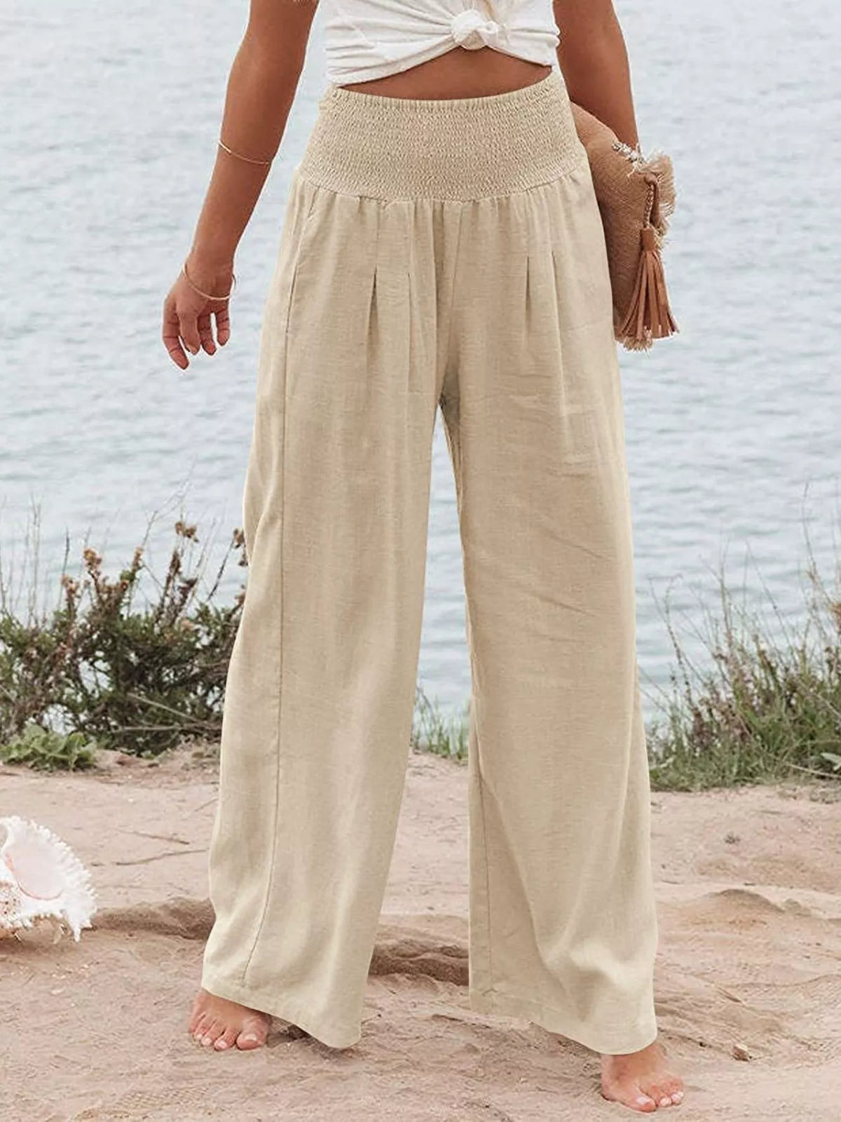 Smocked high waisted wide leg pants close up view