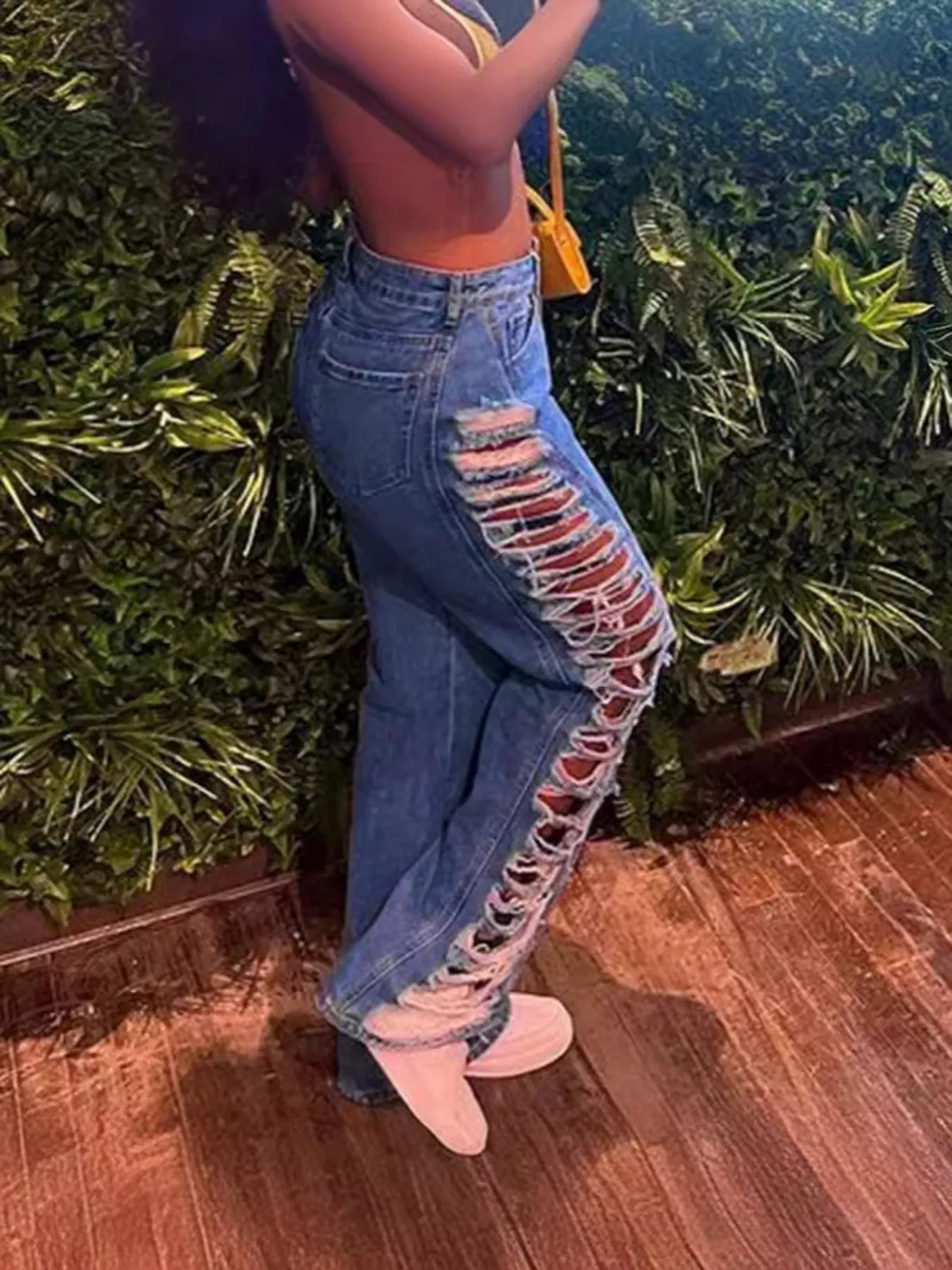 Medium wash side distressed jeans full length view
