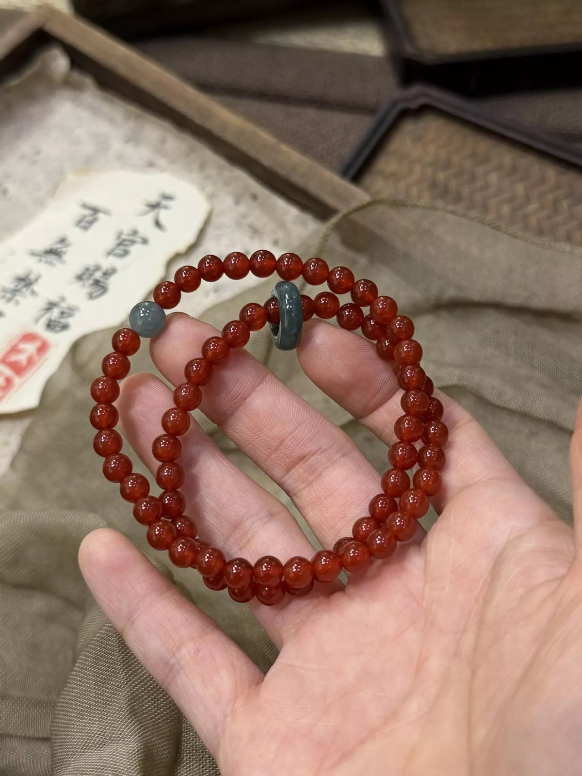Double strand burgundy agate bracelet flat lay