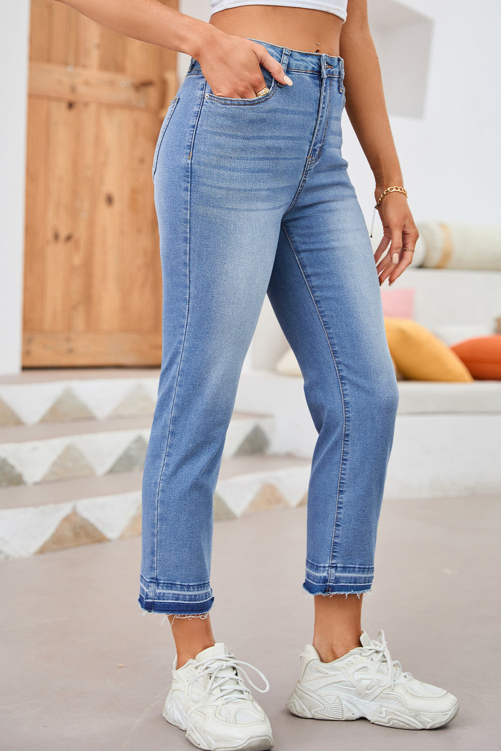 Cropped mid rise jeans hem close up