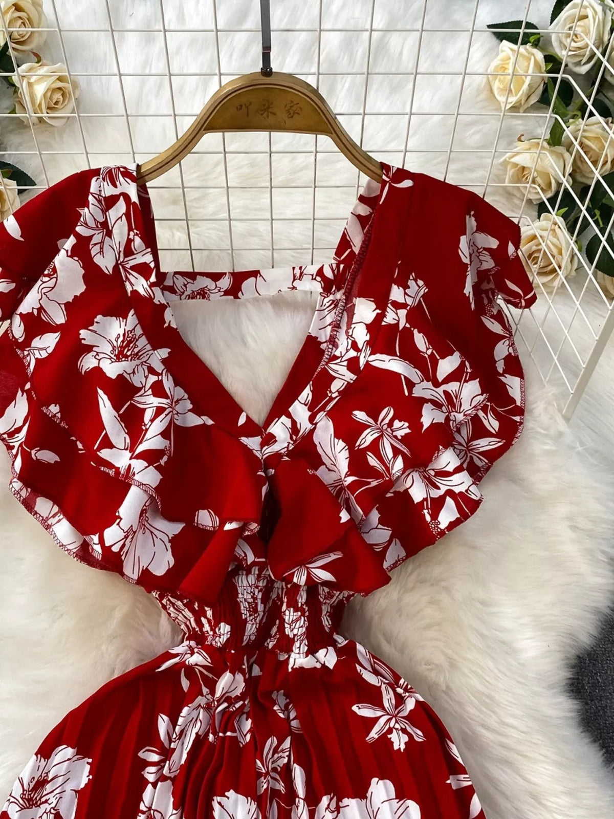 Floral print wide leg pleated jumpsuit close up view