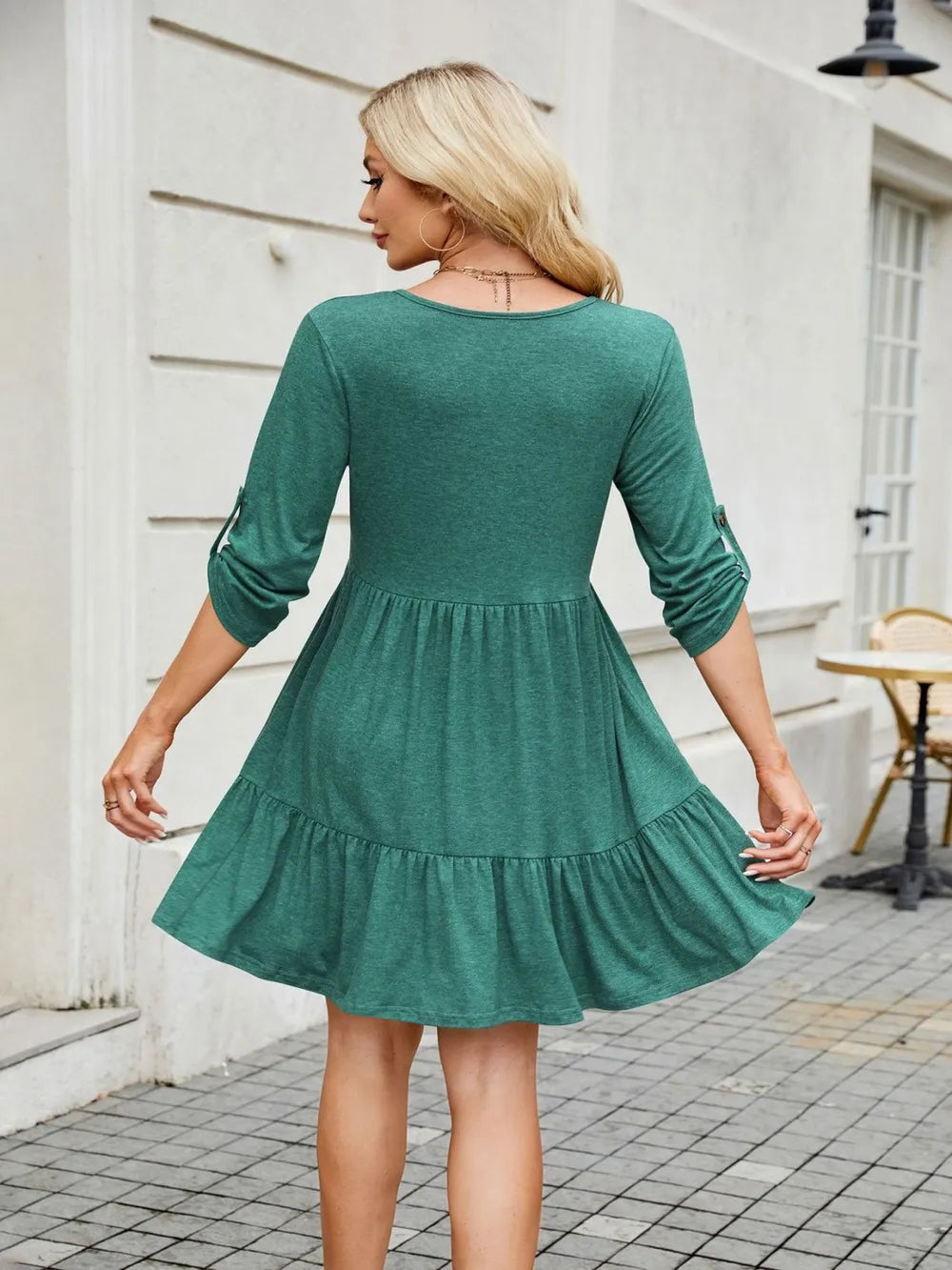 Side view of tiered ruched mini dress