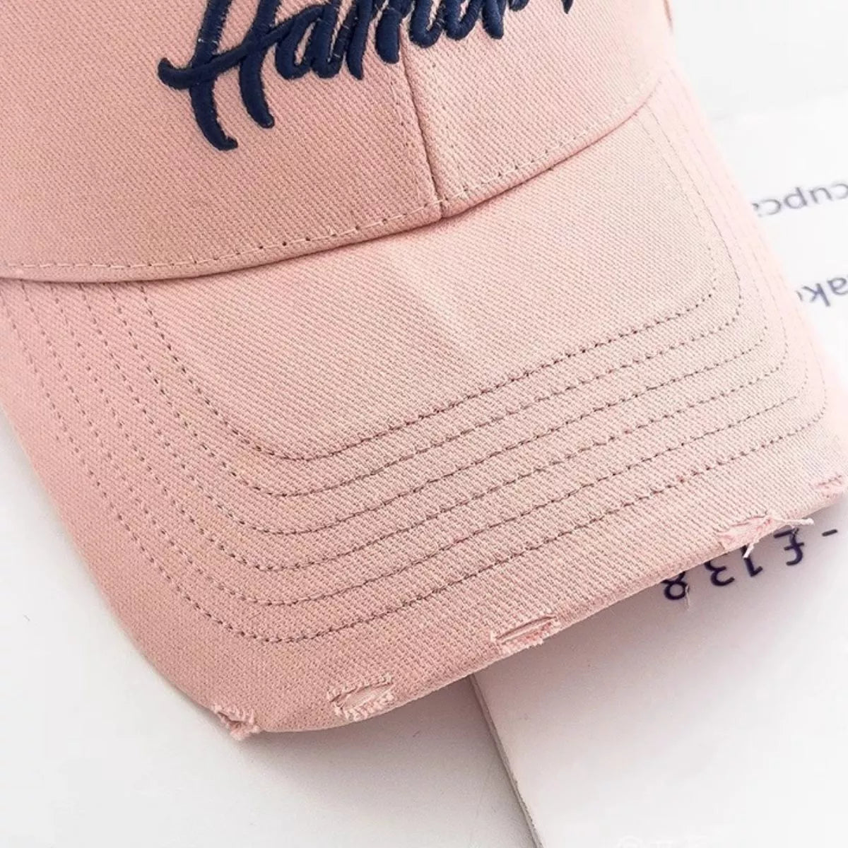 Back view of the cotton cap showing the closure strap