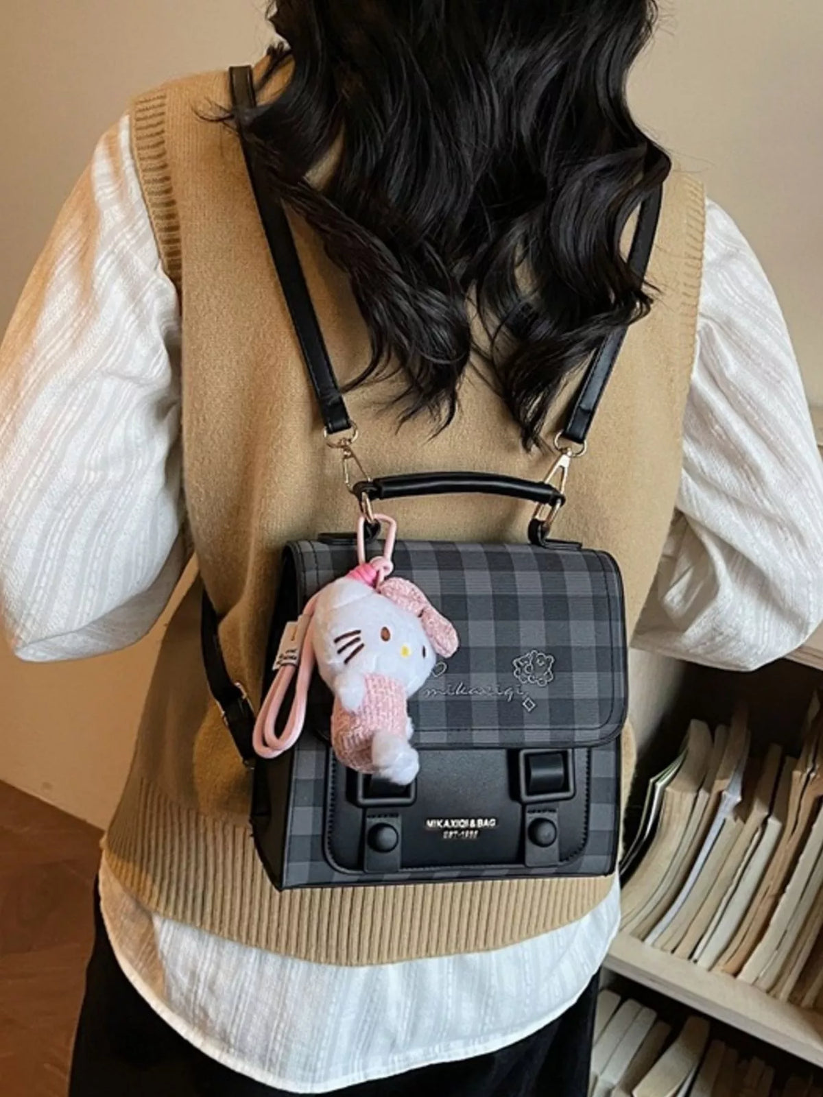 Black plaid embroidered flap mini backpack interior compartment