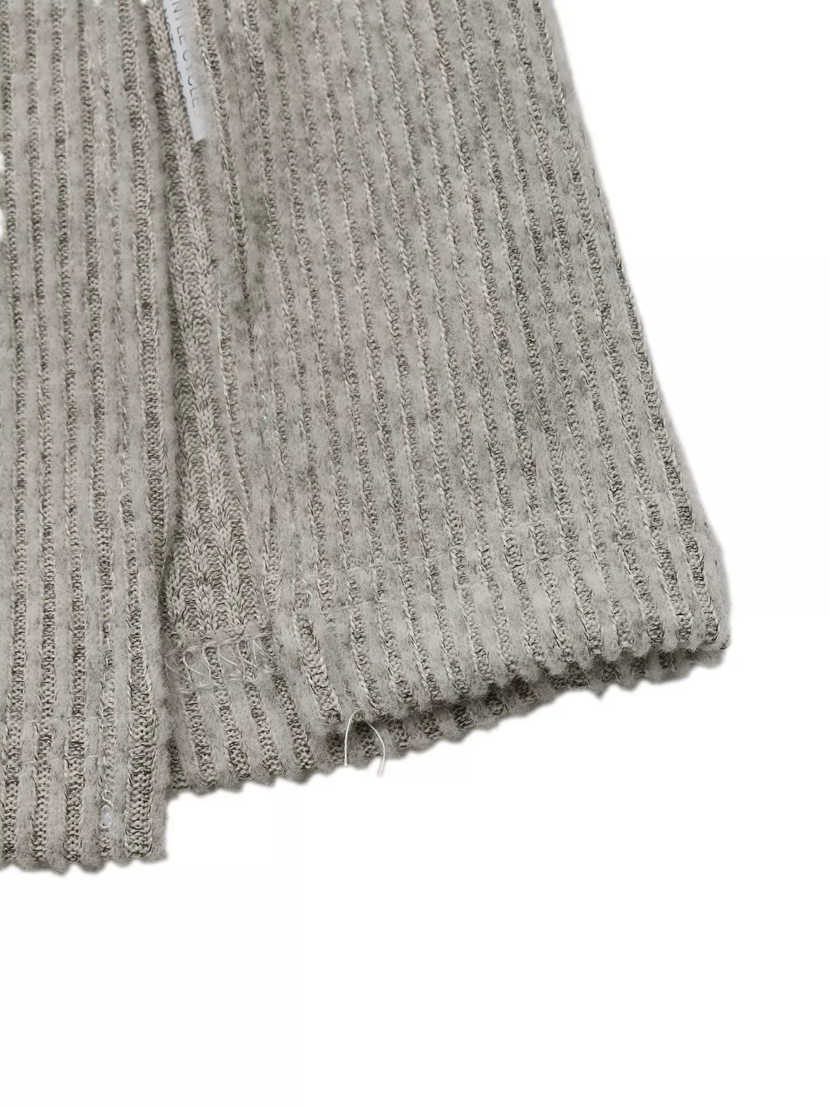 Neckline and shoulder detail of the ribbed dress