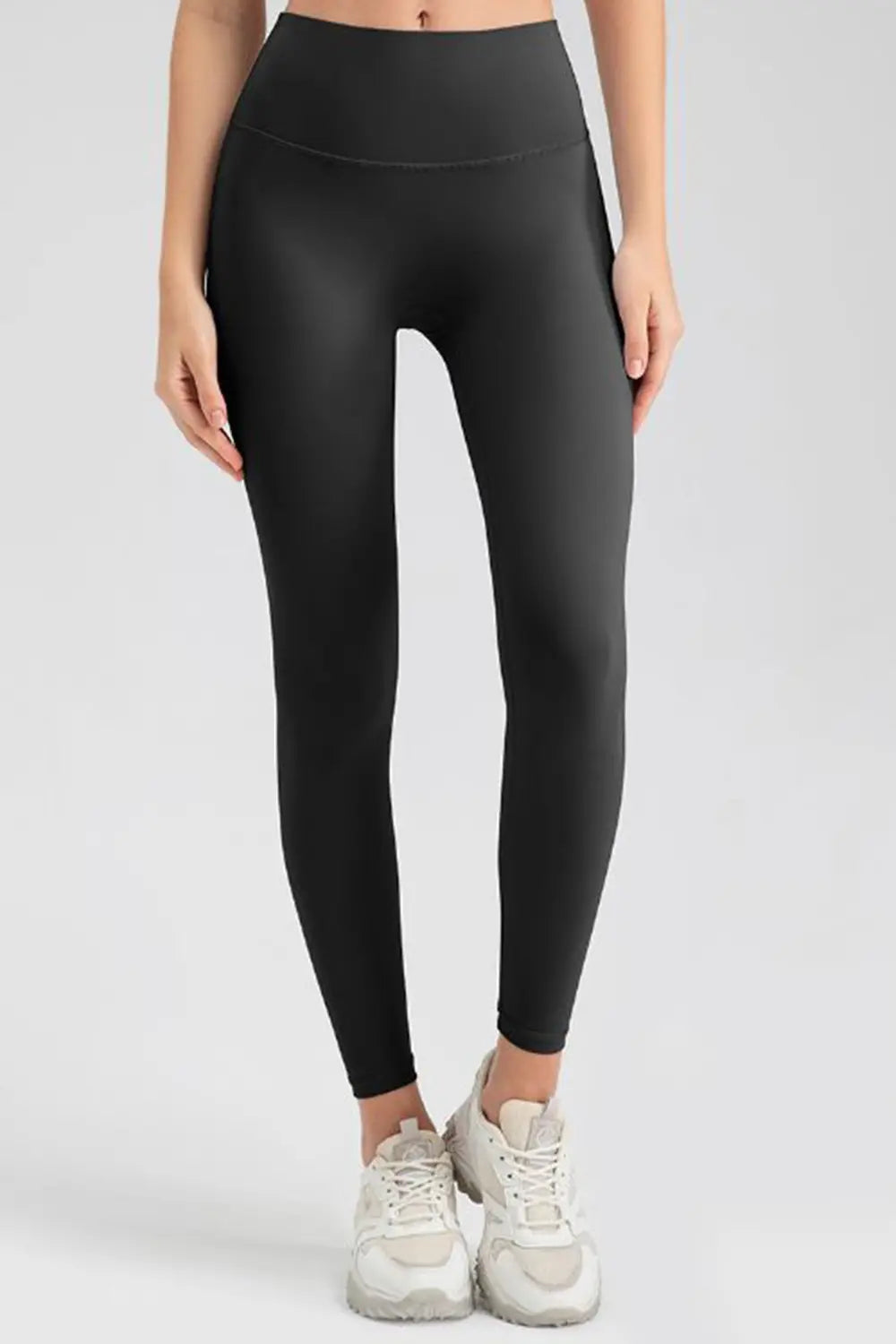 wide waistband sport leggings worn with denim