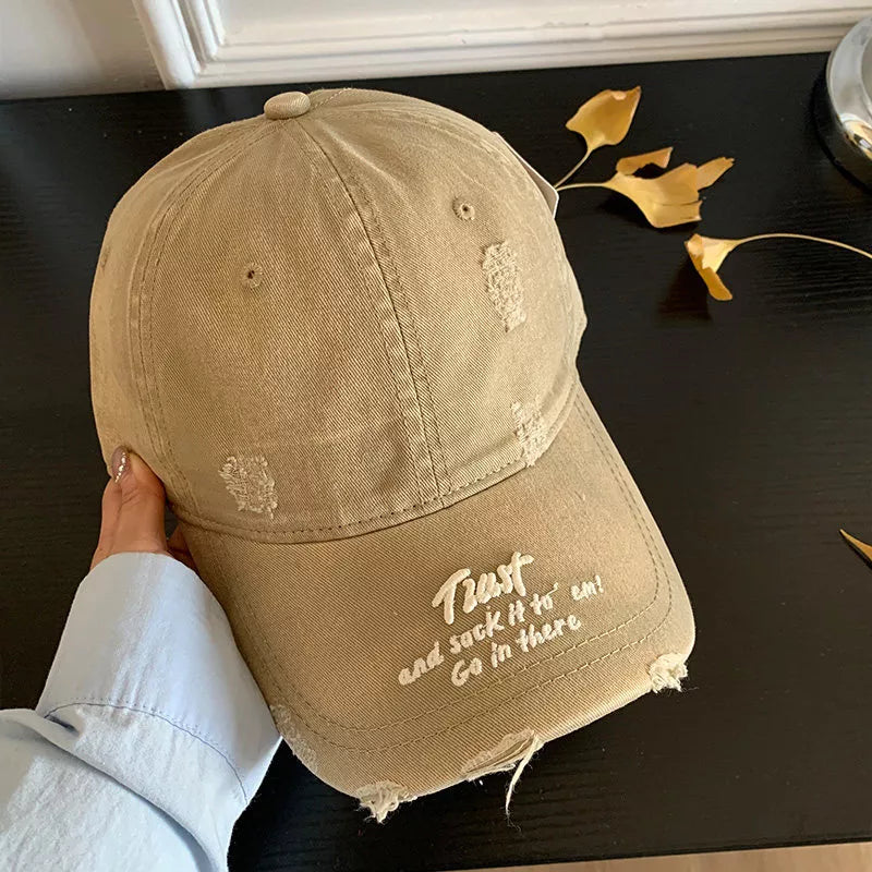 Distressed cap brim and stitching detail