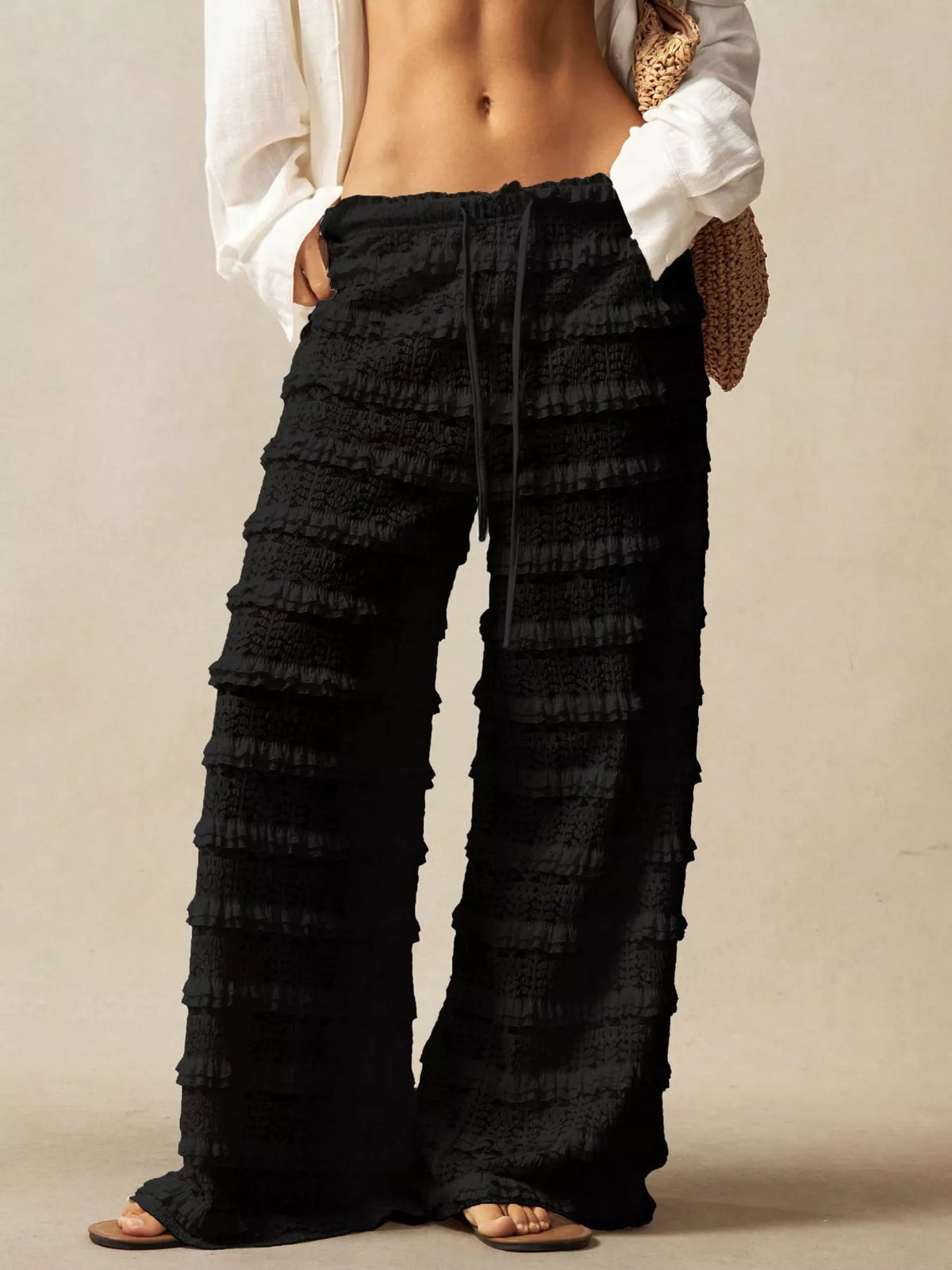 Black lace drawstring wide leg pants front view