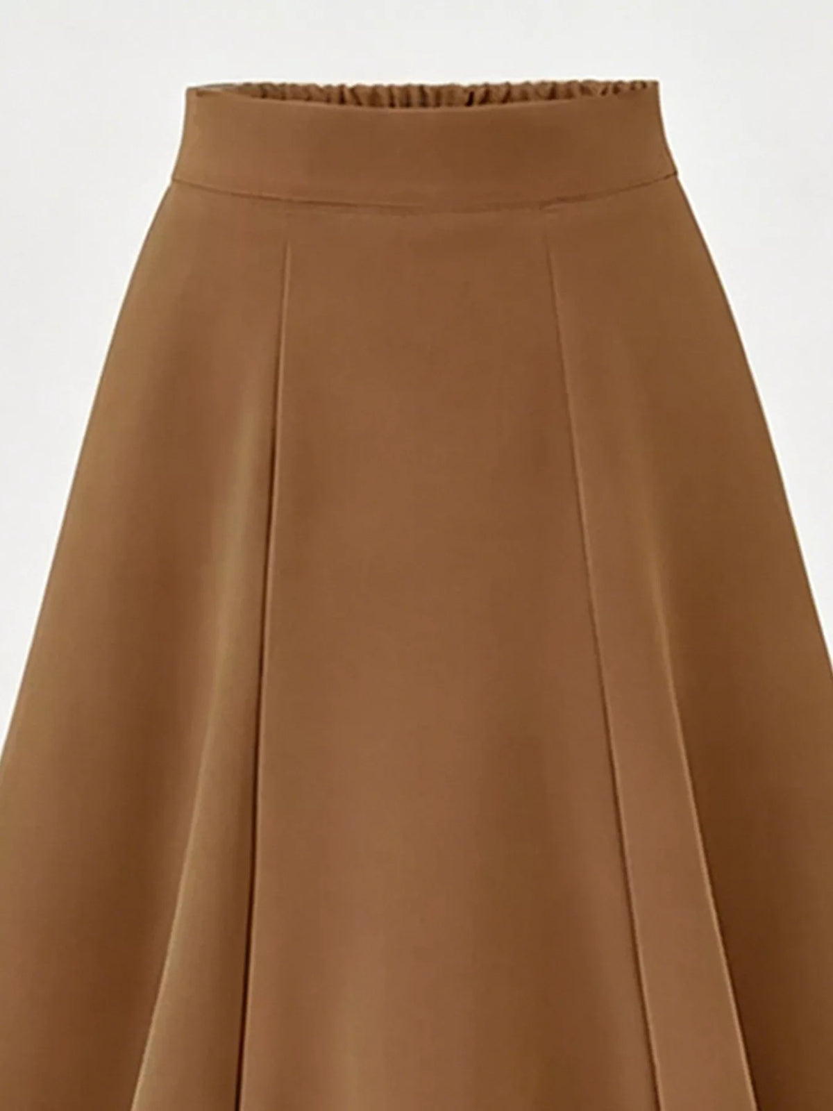 Midi skirt styled with a fitted tucked top