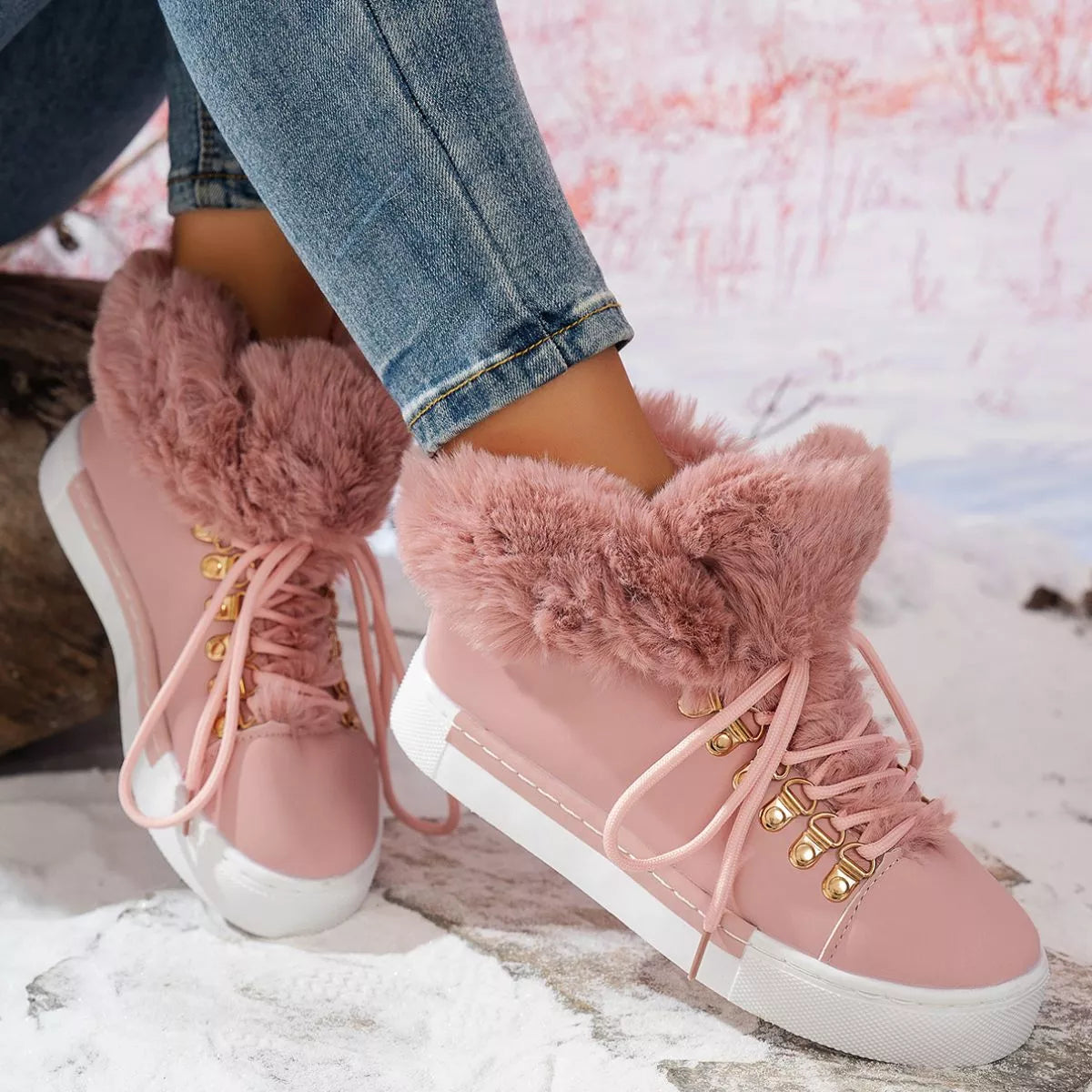 Fuzzy trim lace up ankle boots worn on the foot