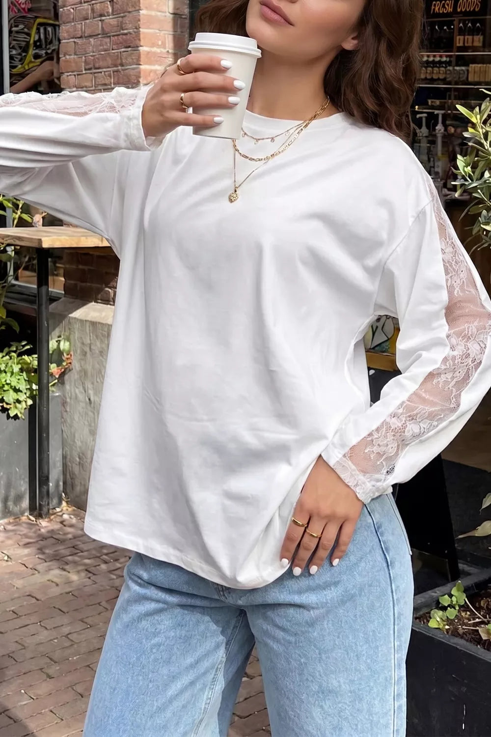 Front view of the white lace patchwork top