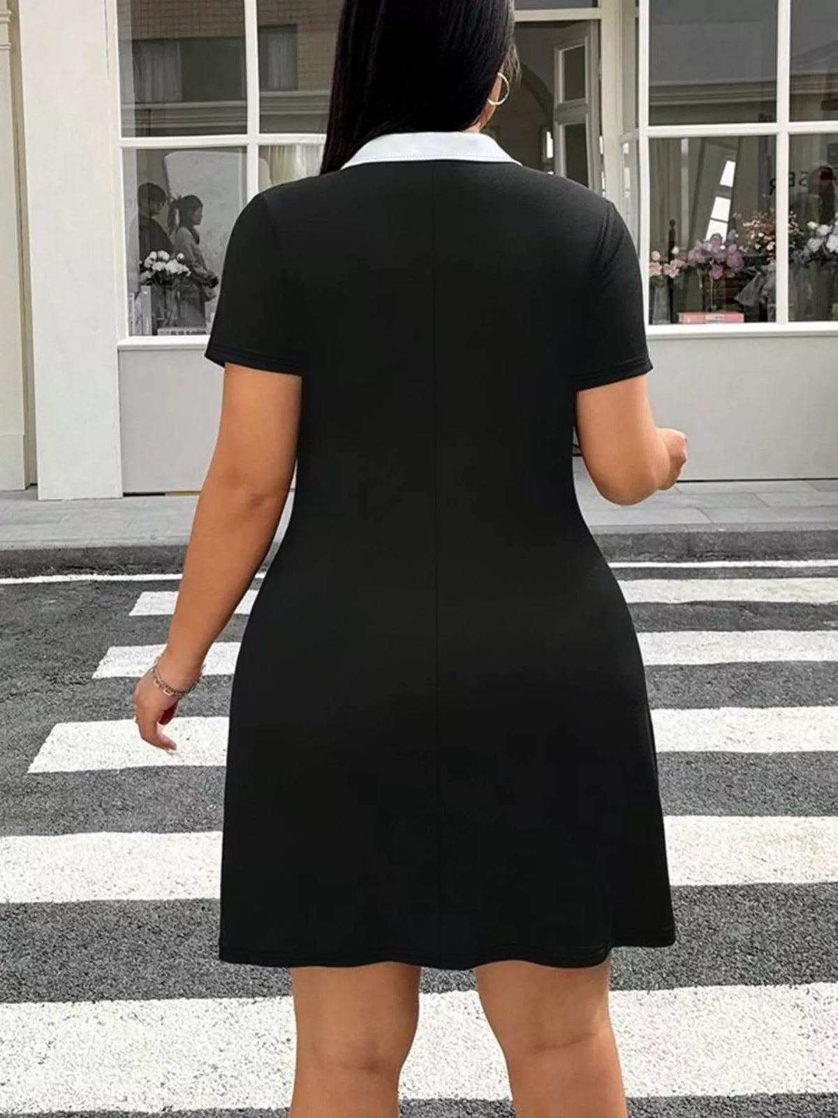Plus size black bodycon mini dress styling detail