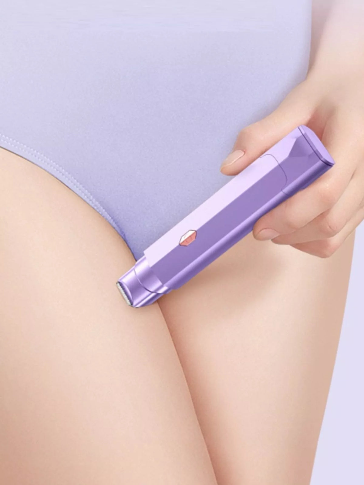 Epilator held in hand
