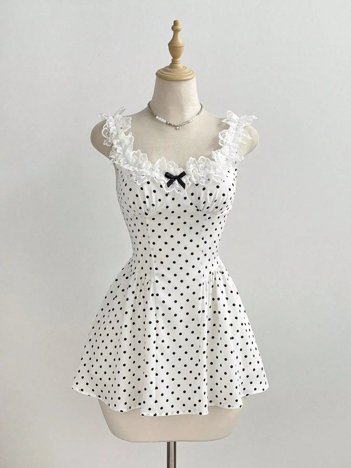 Back view of the lace trim mini dress with zipper