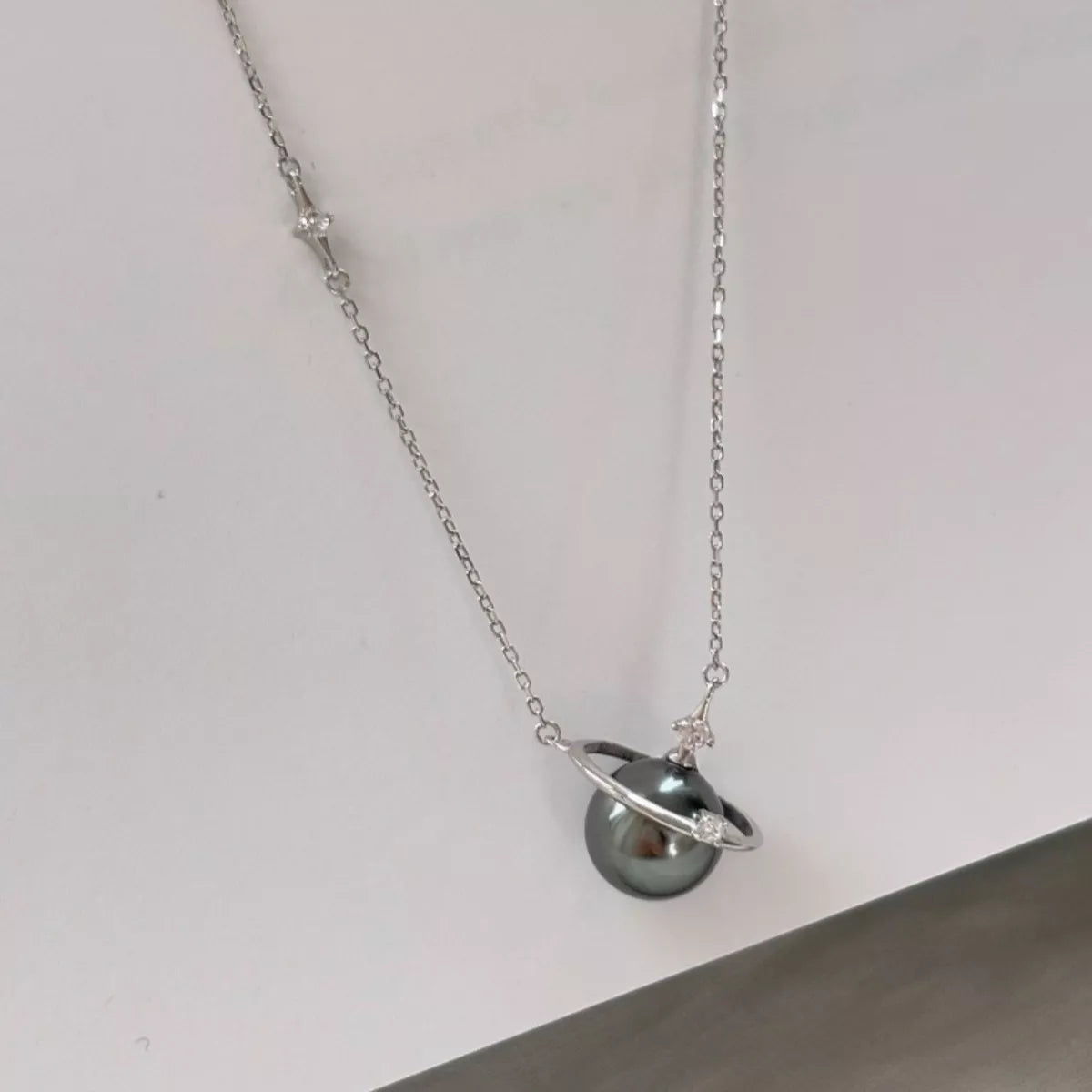 Planet pearl pendant necklace on sterling silver chain back view