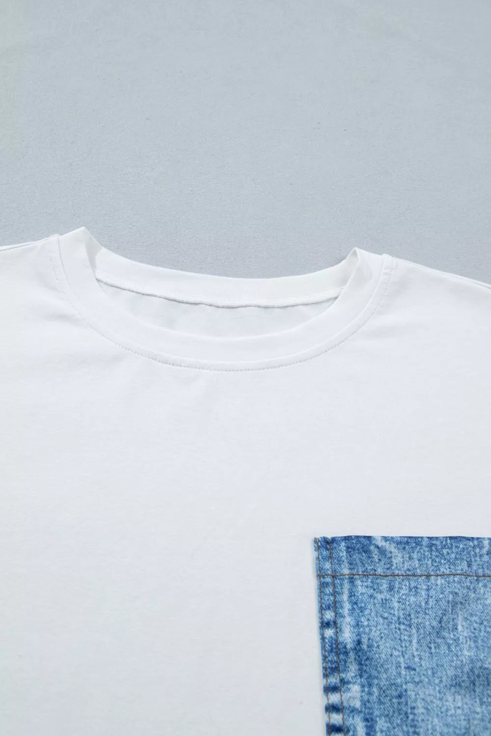 White color block short sleeve top with chest pocket on model