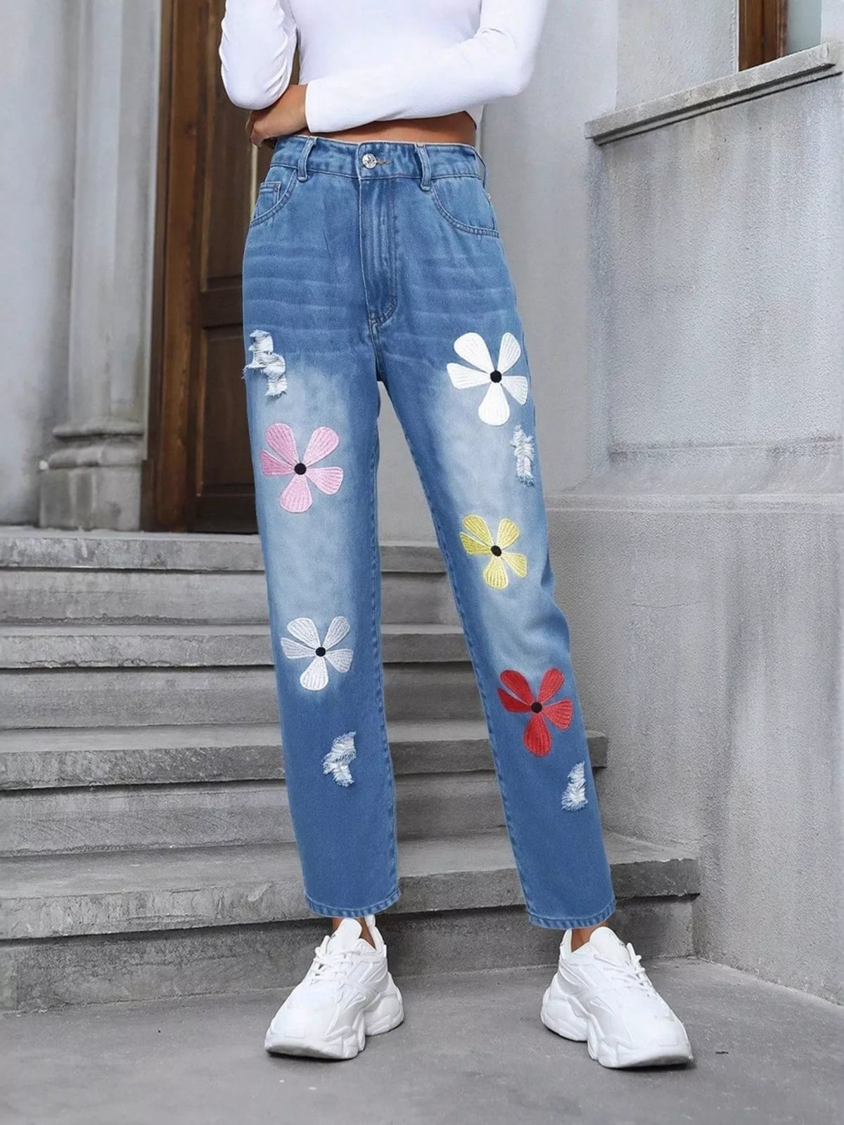Distressed denim side profile with floral detail