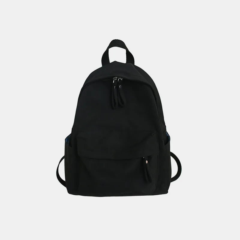Cotton zip top backpack held in hand