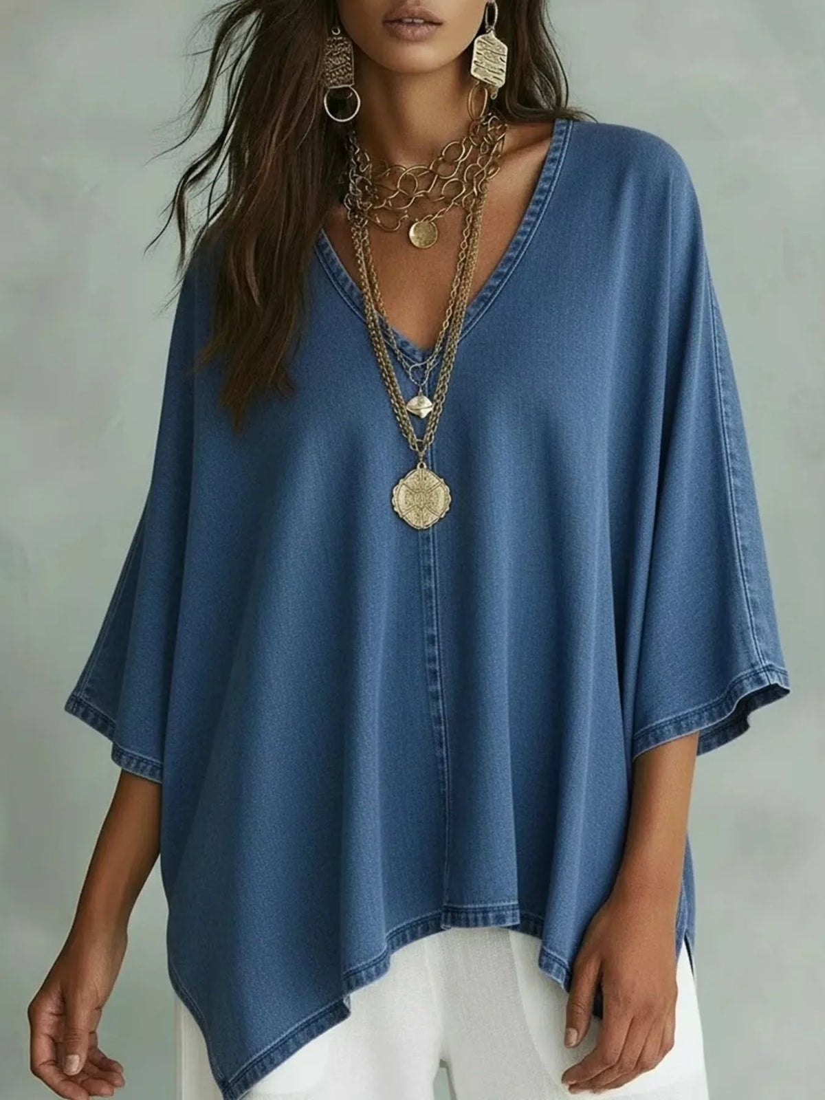 Womens loose fit tee shown at a side angle