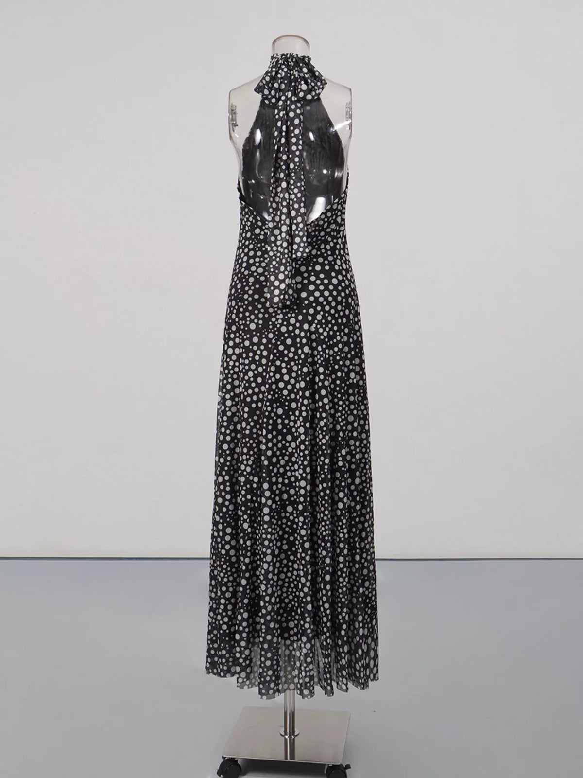 Black halter neck polka dot maxi dress, neckline and bodice detail