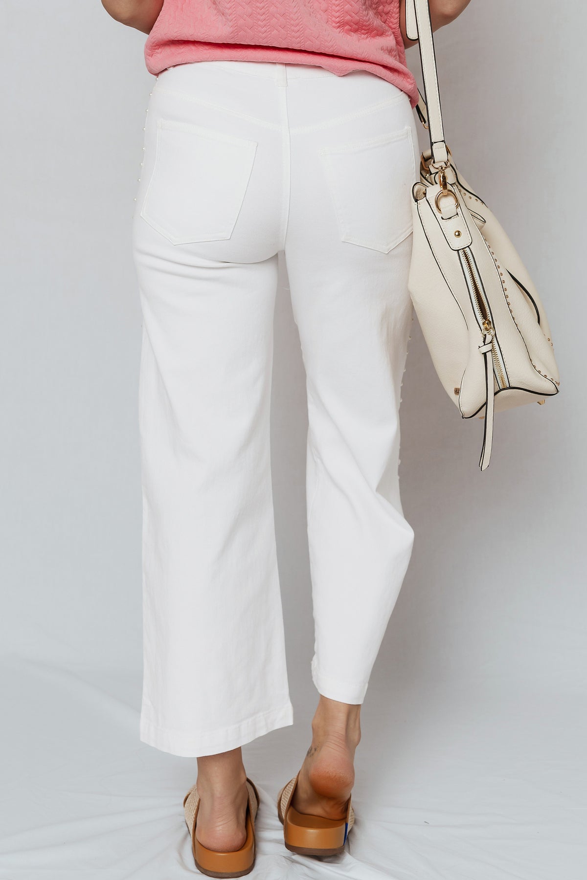 White high waisted flare jeans side view with pearl seam