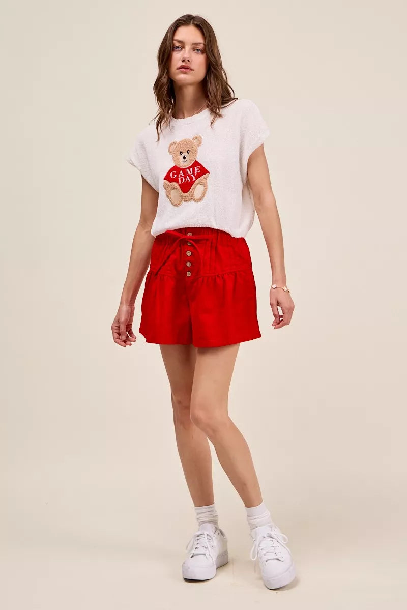 Red denim shorts embroidered hem detail