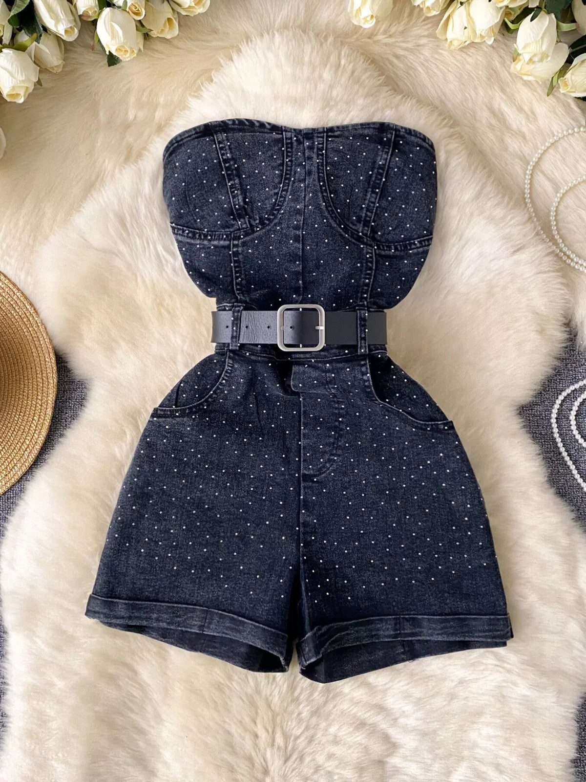 Blue strapless denim romper with diamante detail close up view