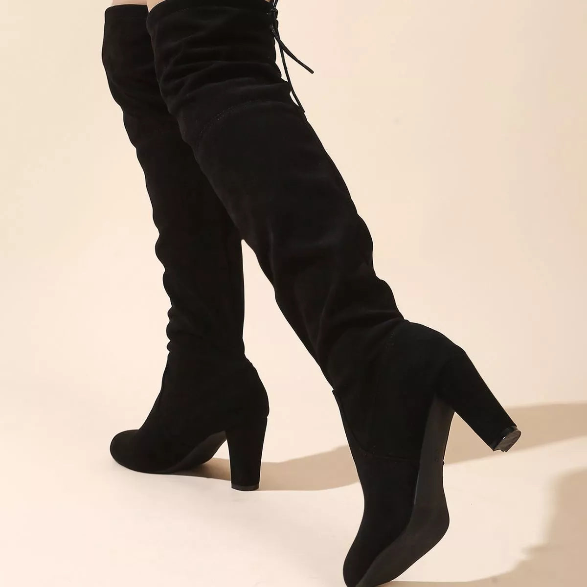 Over the knee high heel suede boots sole view